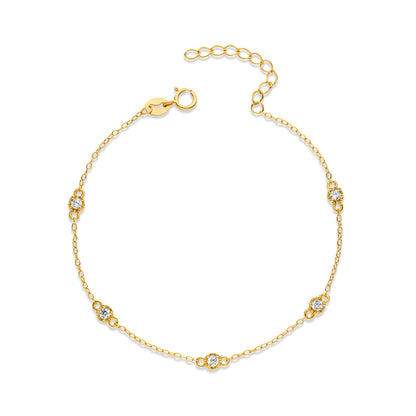 Gold bracelet with diamond accents on a white background